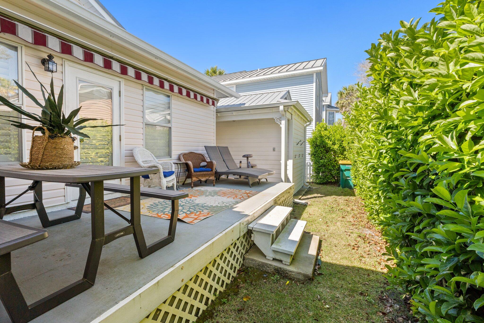 4460 Ocean View Drive Destin, FL 32541 - Photo 47 of 53 a view of a chair and tables in the patio