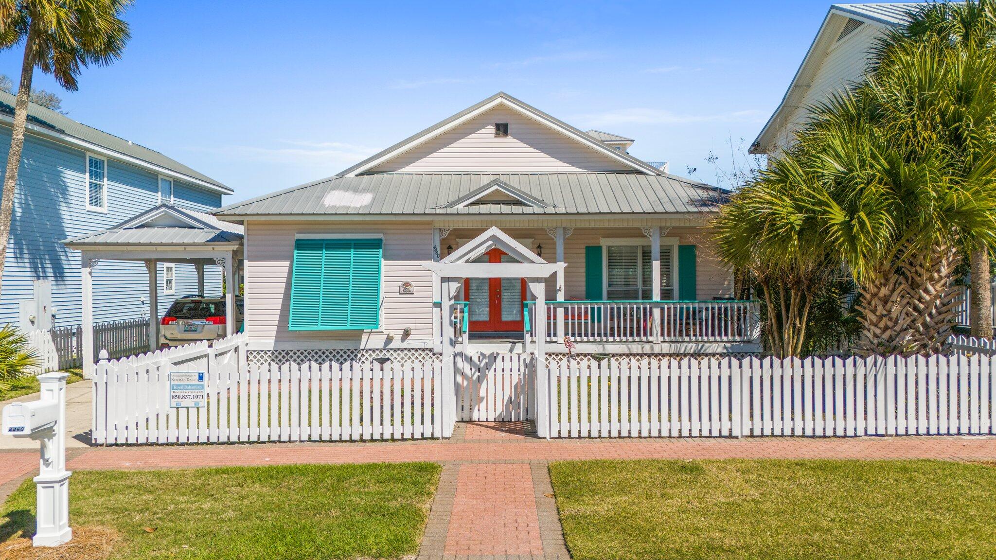 4460 Ocean View Drive Destin, FL 32541 - Photo 49 of 53 a front view of a house with a garden and deck