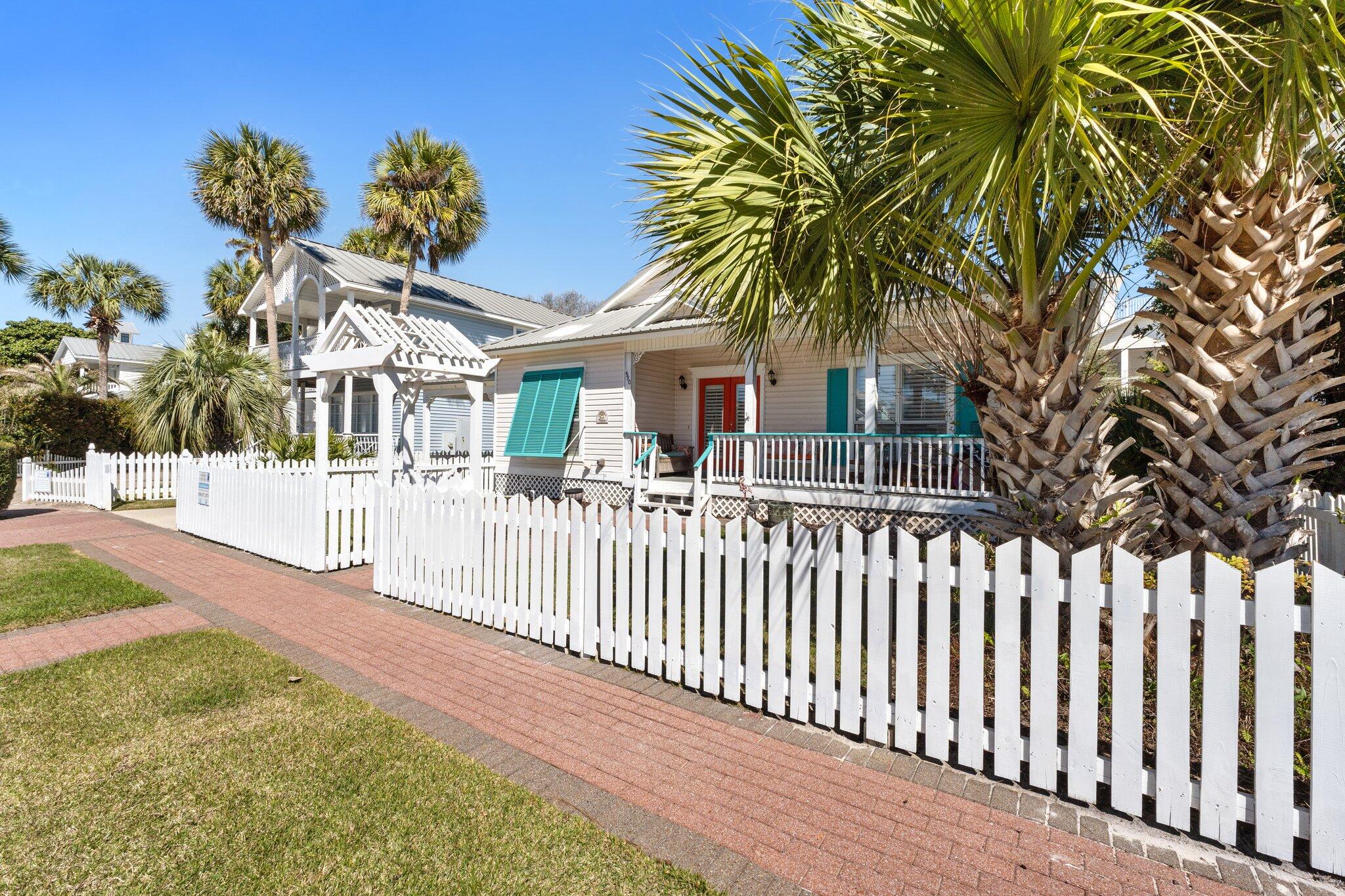 4460 Ocean View Drive Destin, FL 32541 - Photo 50 of 53 a view of a house with a small yard and plants