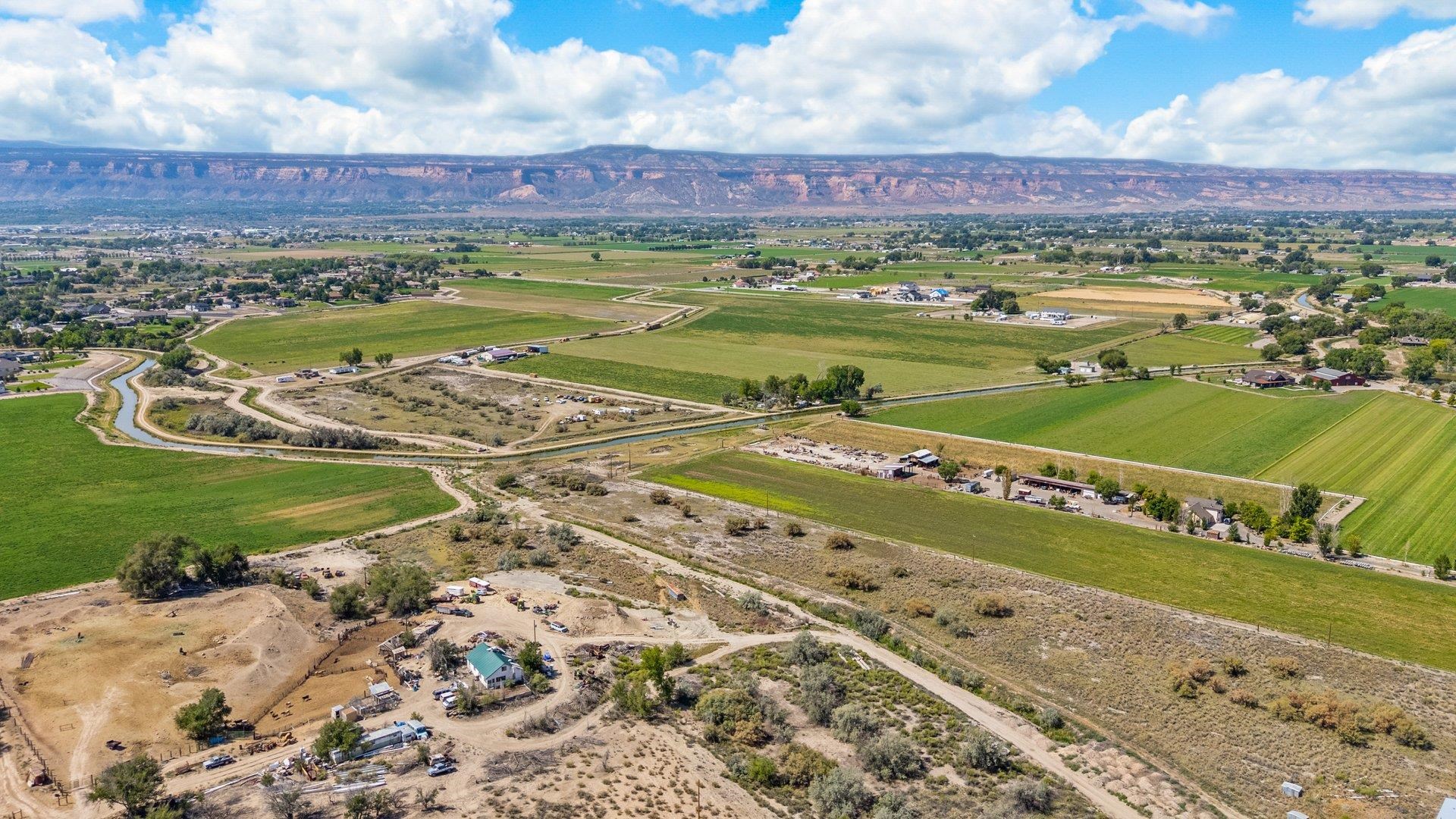 1050 22 1/2 Road Grand Junction, CO 81505 - Photo 13 of 20 a view of a swimming pool with a yard