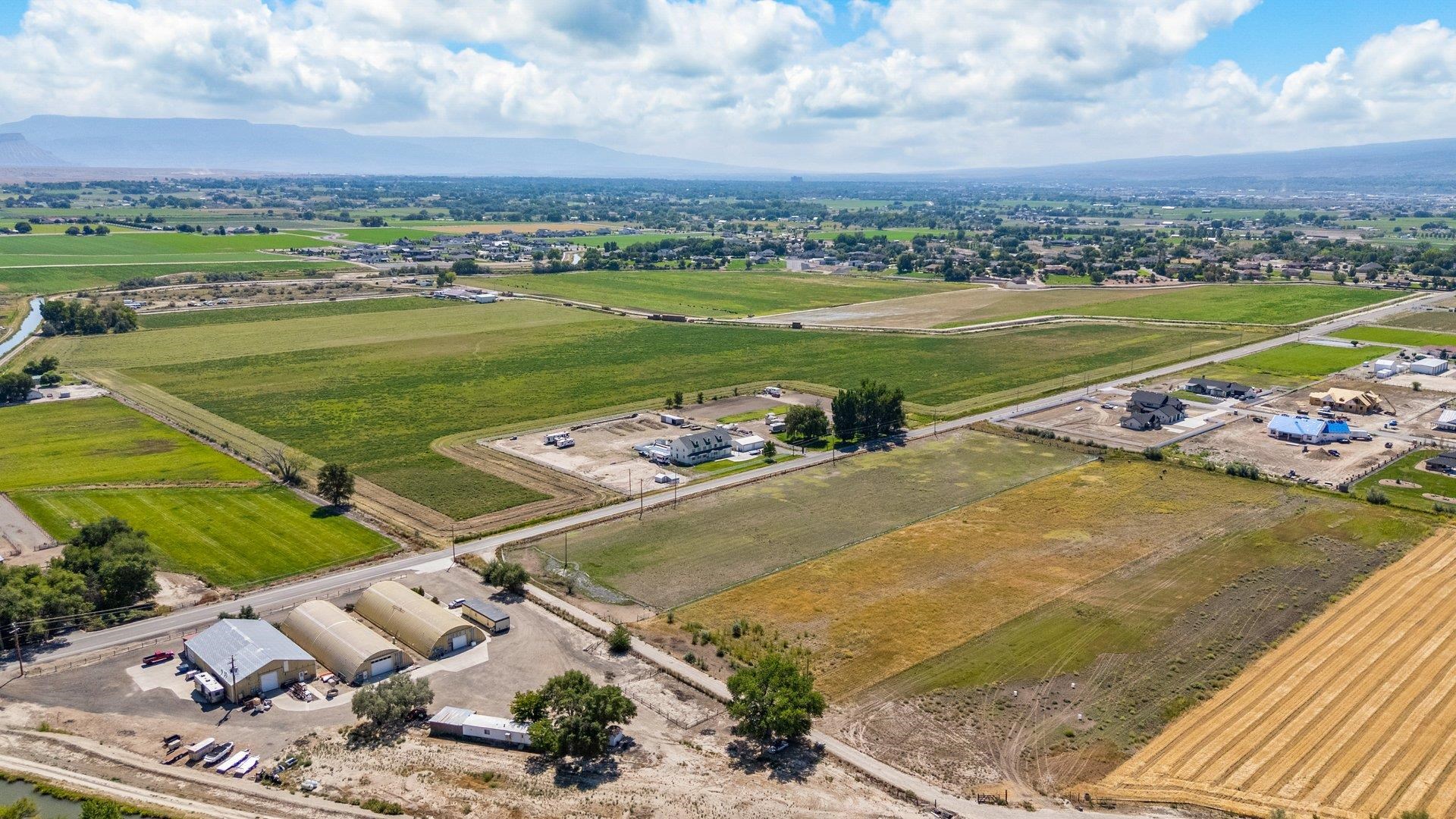 1050 22 1/2 Road Grand Junction, CO 81505 - Photo 17 of 20 an aerial view of a pool a yard patio and mountain view in back
