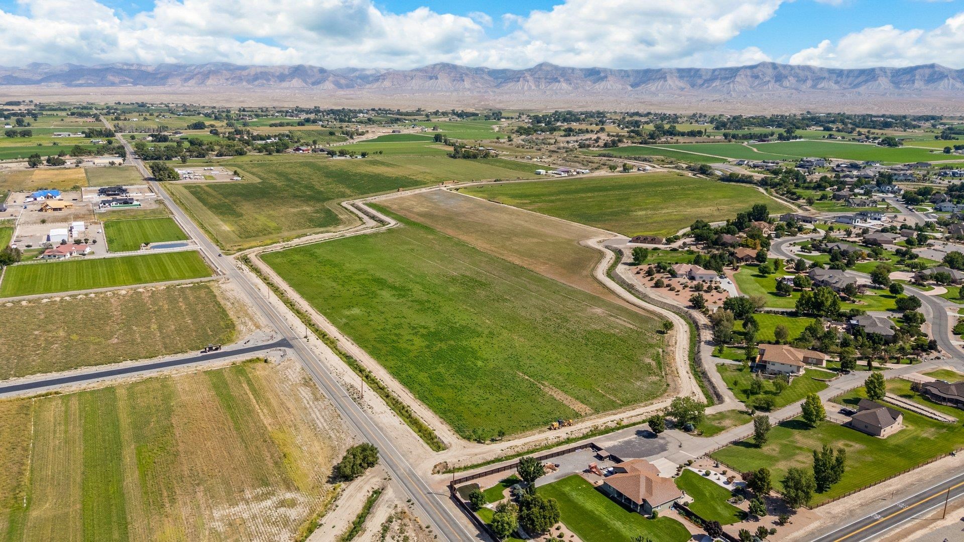 1050 22 1/2 Road Grand Junction, CO 81505 - Photo 3 of 20 an aerial view of residential houses with outdoor space and river