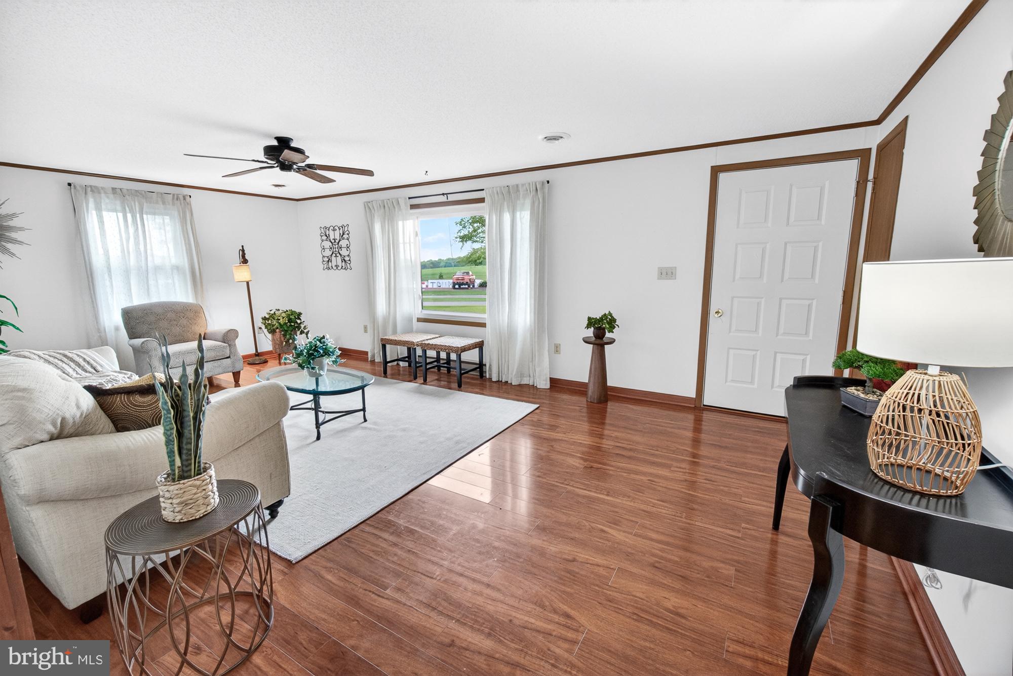 5601 Woodville Road Mount Airy, MD 21771 - Photo 19 of 54 a living room with furniture and wooden floor