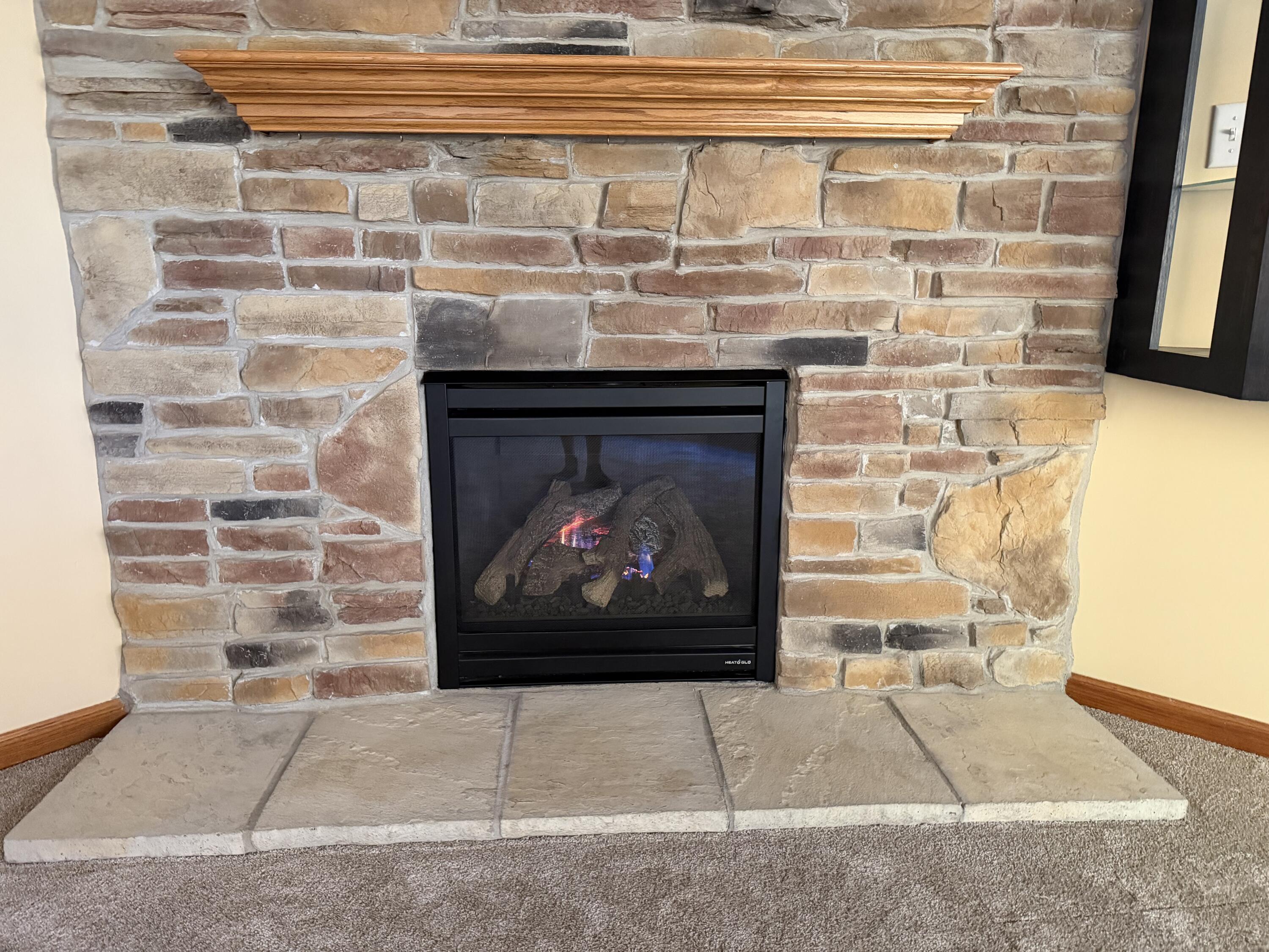 1521 Birdie Way Chesterton, IN 46304 - Photo 22 of 58 a fireplace with a outdoor space