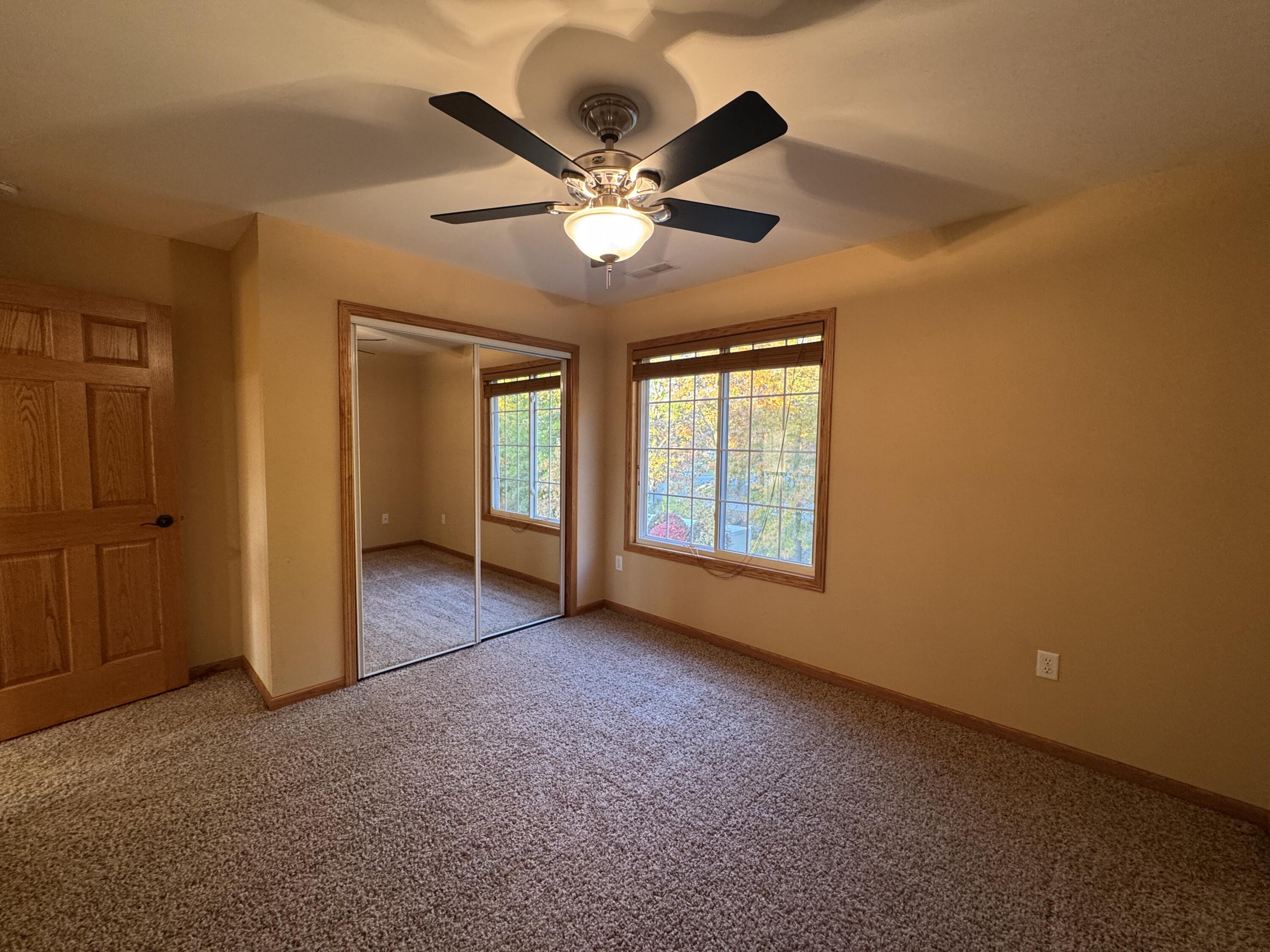 1521 Birdie Way Chesterton, IN 46304 - Photo 43 of 58 an empty room with ceiling fan and window