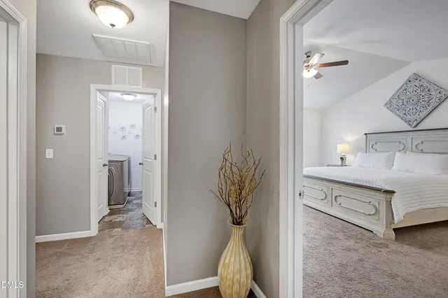 a view of a bedroom from a hallway