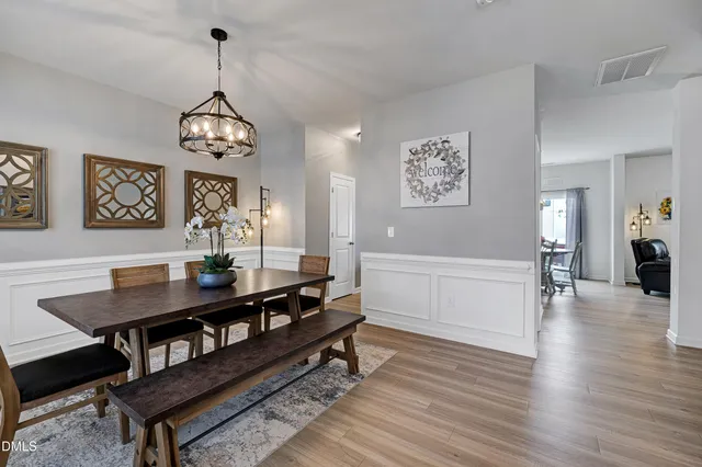 a view of a livingroom with furniture window and wooden floor