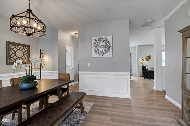 a view of a dining room and wooden floor
