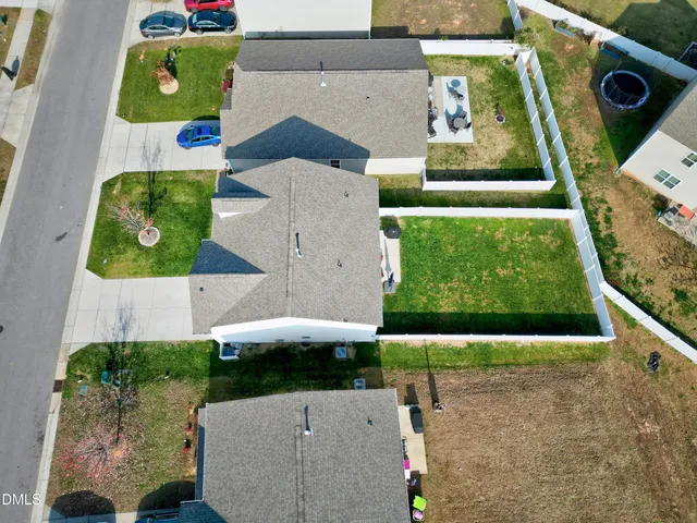 an aerial view of house with yard