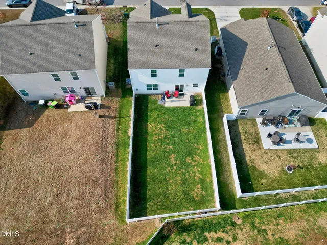 an aerial view of residential house with outdoor space