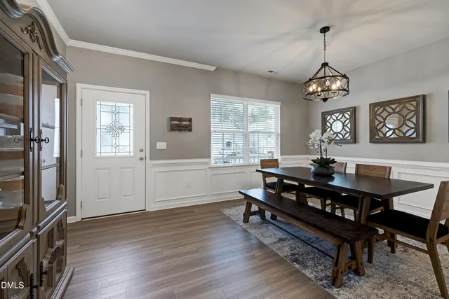 a view of a livingroom with furniture window and wooden floor