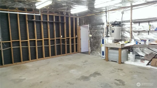 a bathroom with a toilet and a mirror