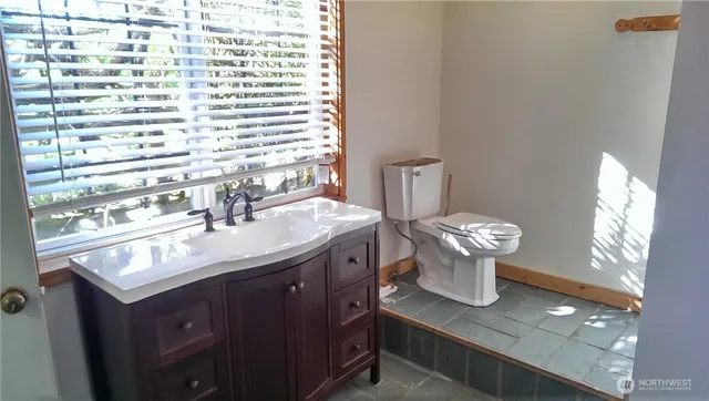 a backyard of apartments with large trees