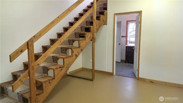 wooden floor with an entryway
