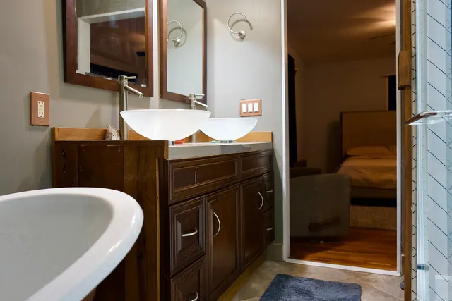a bathroom with a bathtub and a sink