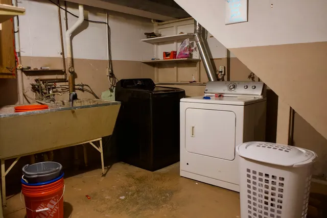 a storage room with washer and dryer