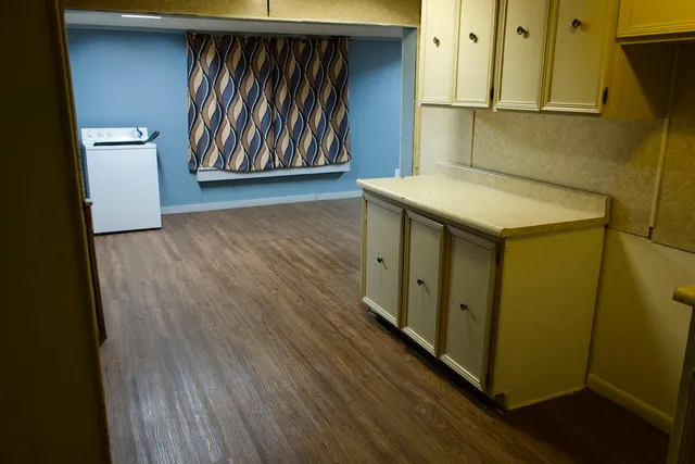 a hallway with wooden door