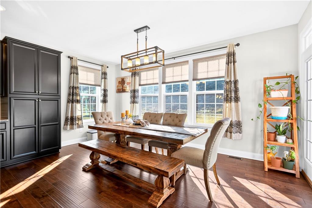 1444 Main Street Pittsburgh, PA 15241 - Photo 14 of 50 a living room with furniture a flat screen tv and a floor to ceiling window