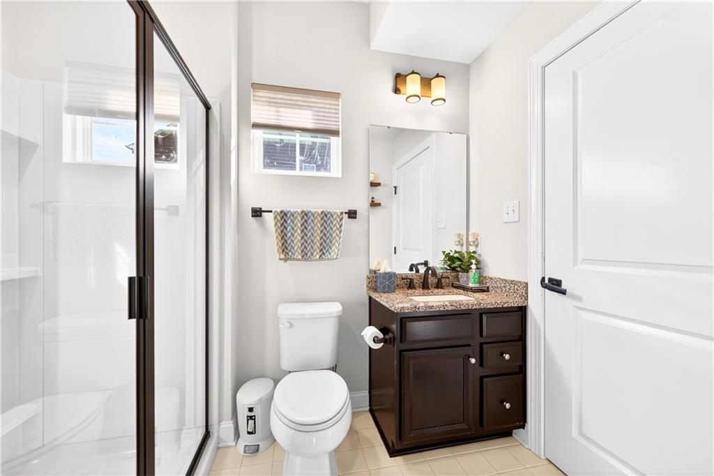 1444 Main Street Pittsburgh, PA 15241 - Photo 20 of 50 a bathroom with a toilet a sink and a mirror