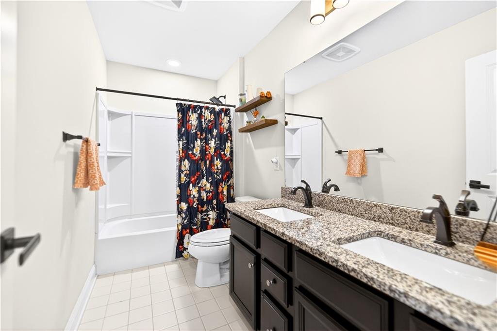 1444 Main Street Pittsburgh, PA 15241 - Photo 28 of 50 a bathroom with a granite countertop sink a toilet and shower