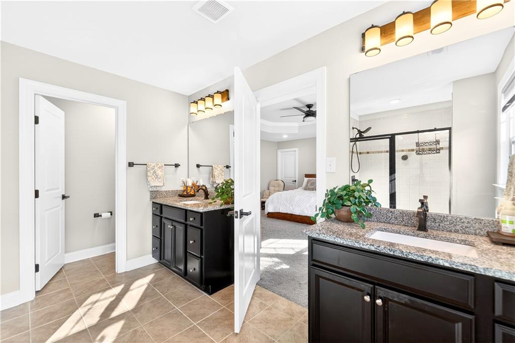 1444 Main Street Pittsburgh, PA 15241 - Photo 35 of 50 a spacious bathroom with a granite countertop sink and a mirror