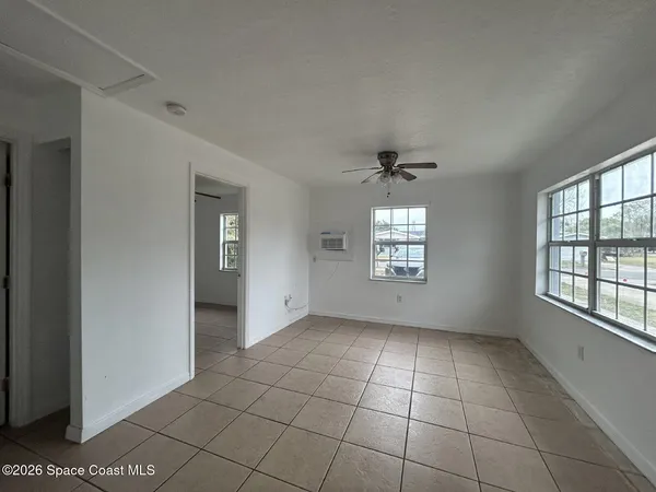 a view of an empty room with a window