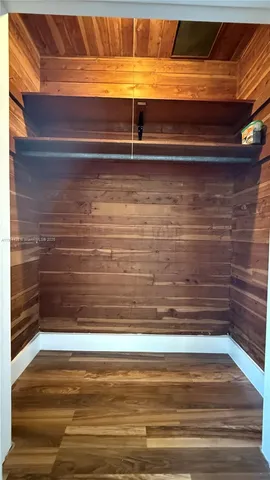 a view of door with wooden floor