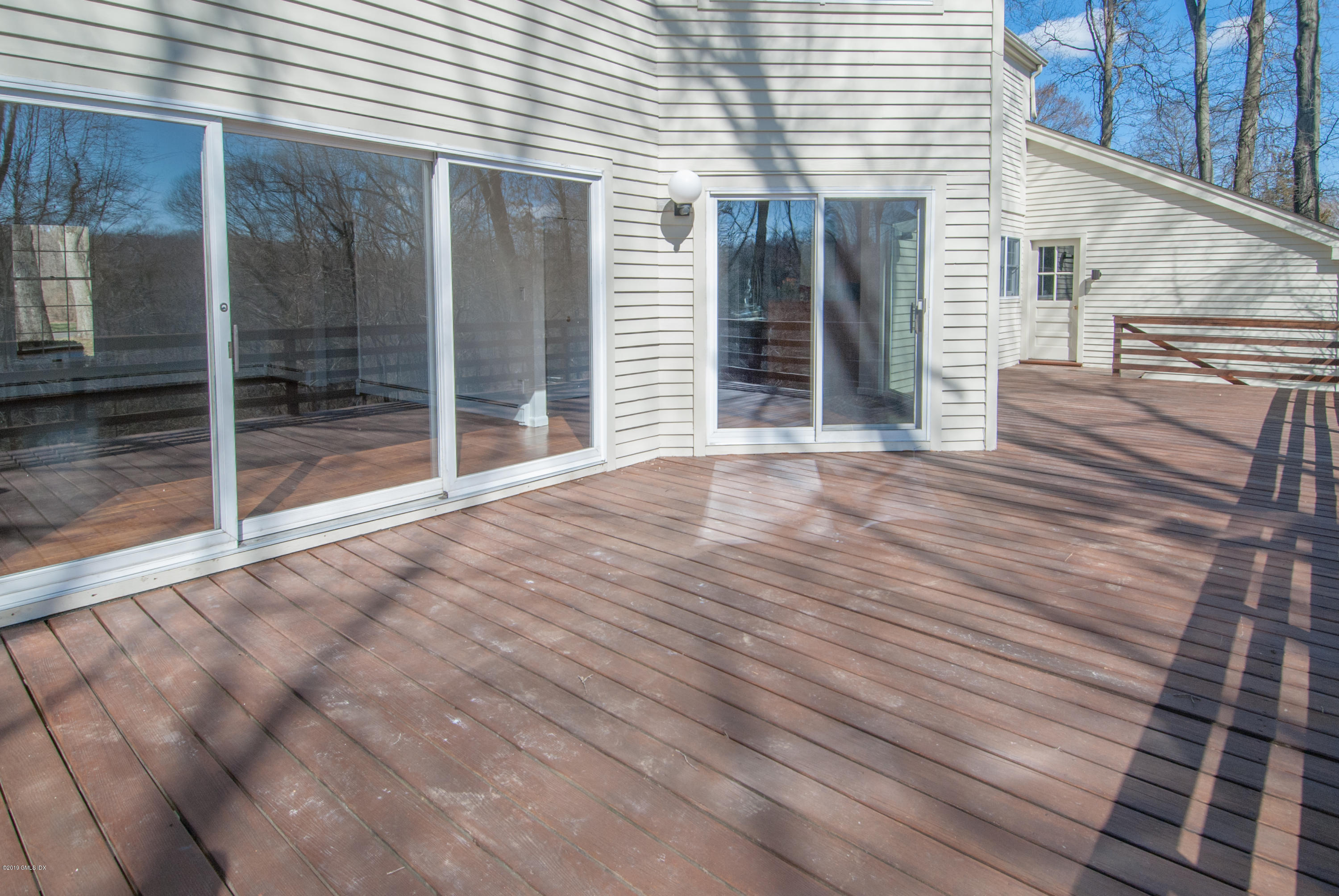 25 Harkim Road Greenwich, CT 06831 - Photo 13 of 14 a view of a house with a balcony