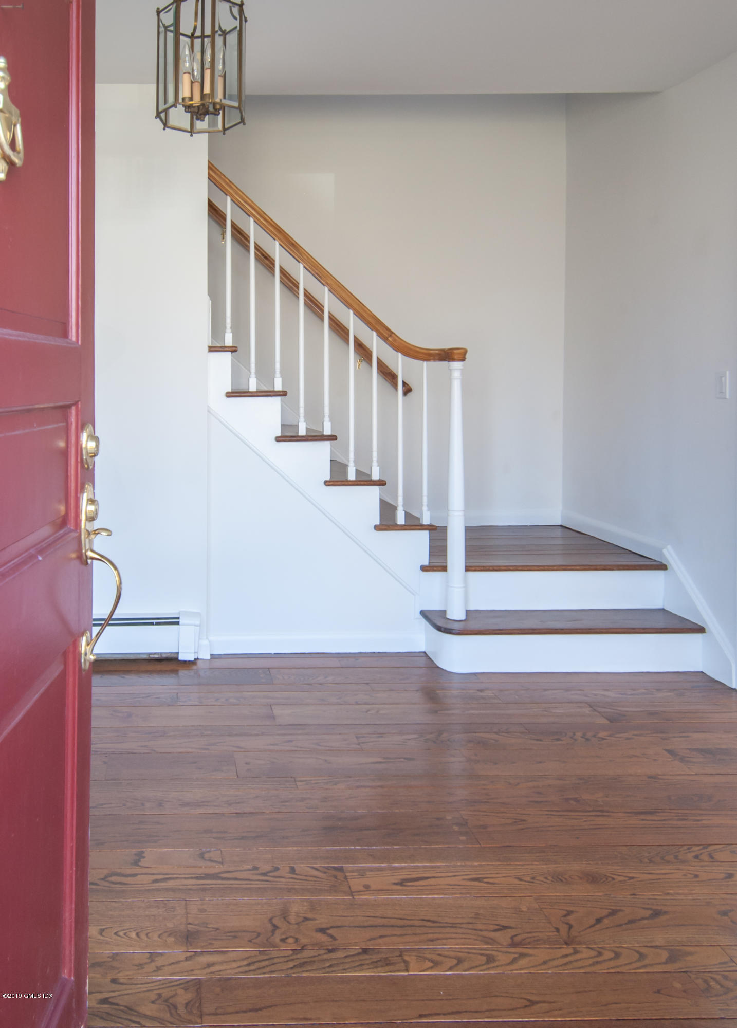 25 Harkim Road Greenwich, CT 06831 - Photo 2 of 14 a view of entryway and hall with wooden floor