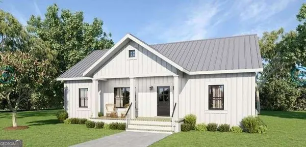 a view of a house with a yard and potted plants