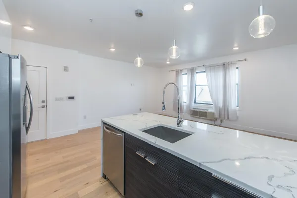a view of kitchen with wooden floor