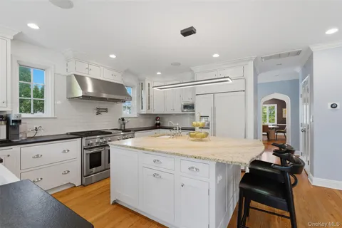 a kitchen with a sink appliances and cabinets