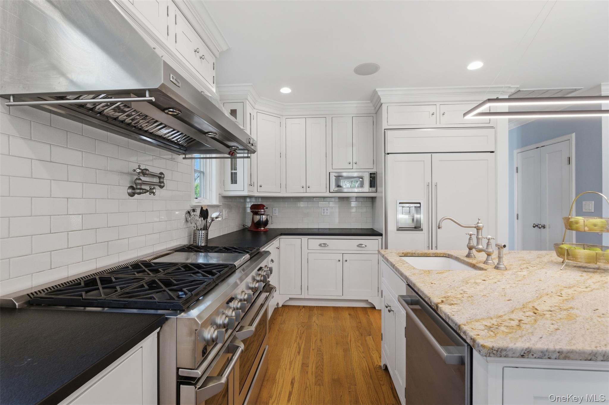 42 Mulberry Lane New Rochelle, NY 10804 - Photo 14 of 43 a kitchen with a sink stove and cabinets