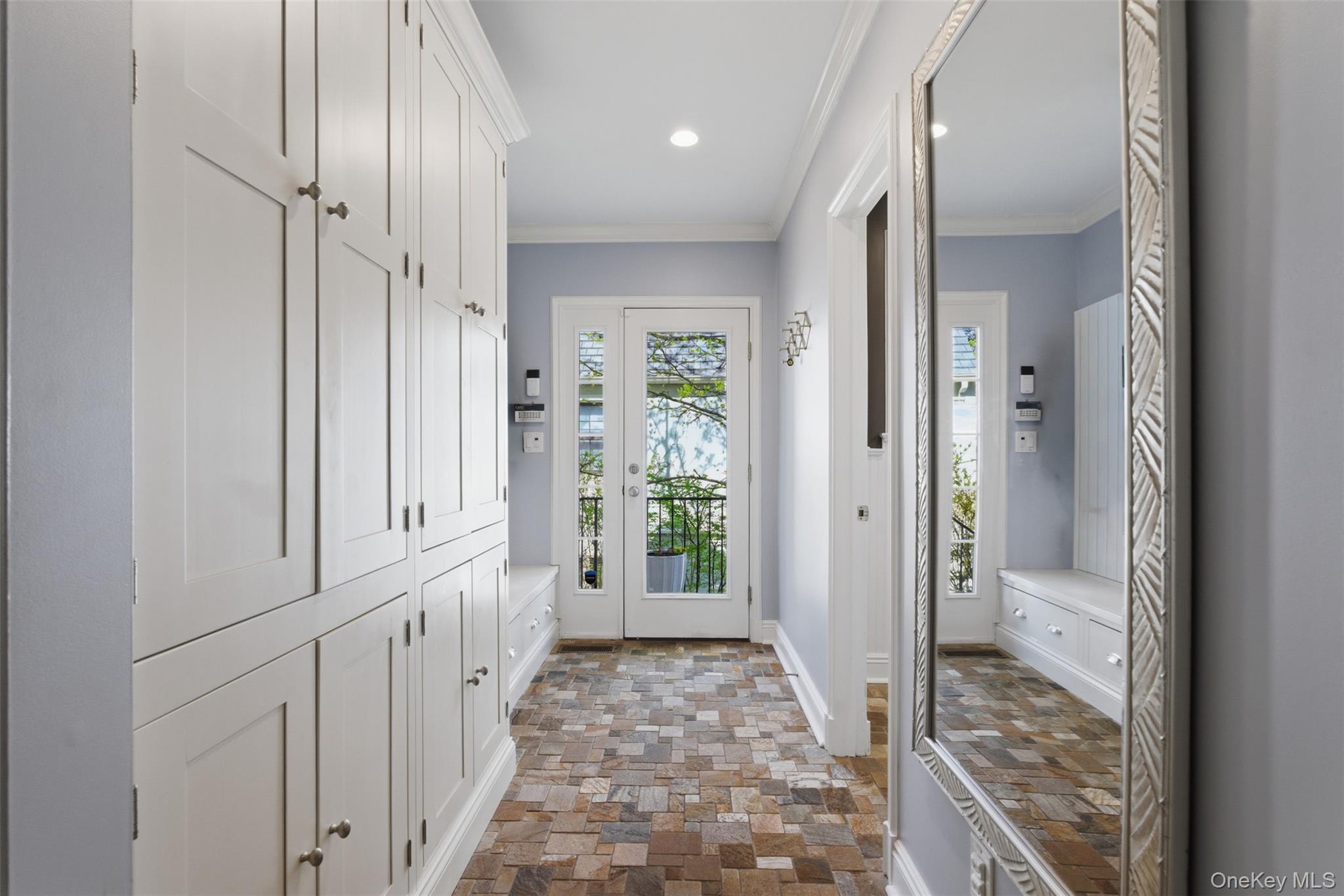 42 Mulberry Lane New Rochelle, NY 10804 - Photo 19 of 43 a view of a hallway to a livingroom with wooden floor and windows