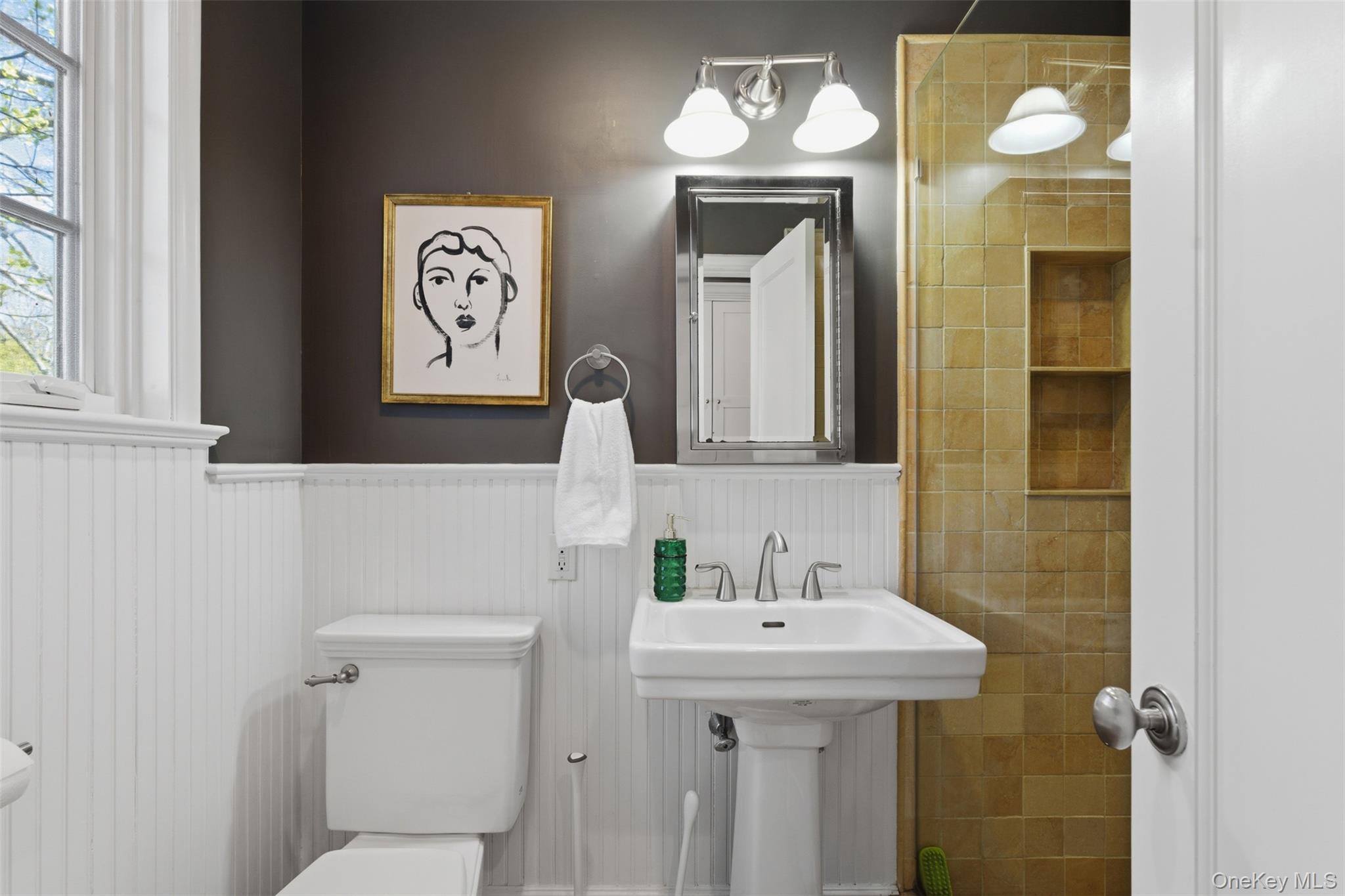 42 Mulberry Lane New Rochelle, NY 10804 - Photo 20 of 43 a bathroom with a sink and a mirror
