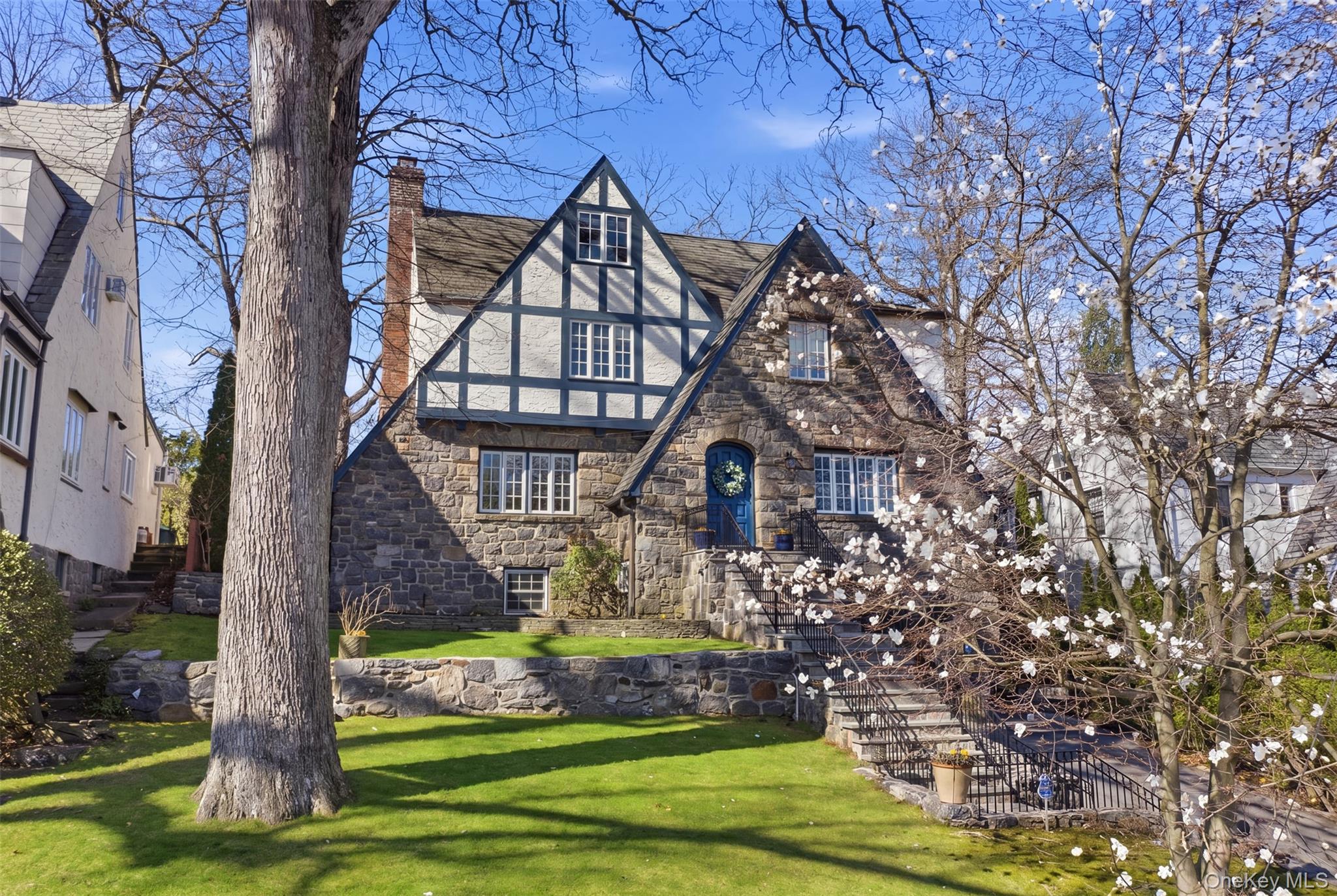 42 Mulberry Lane New Rochelle, NY 10804 - Photo 2 of 43 a front view of a house with a yard
