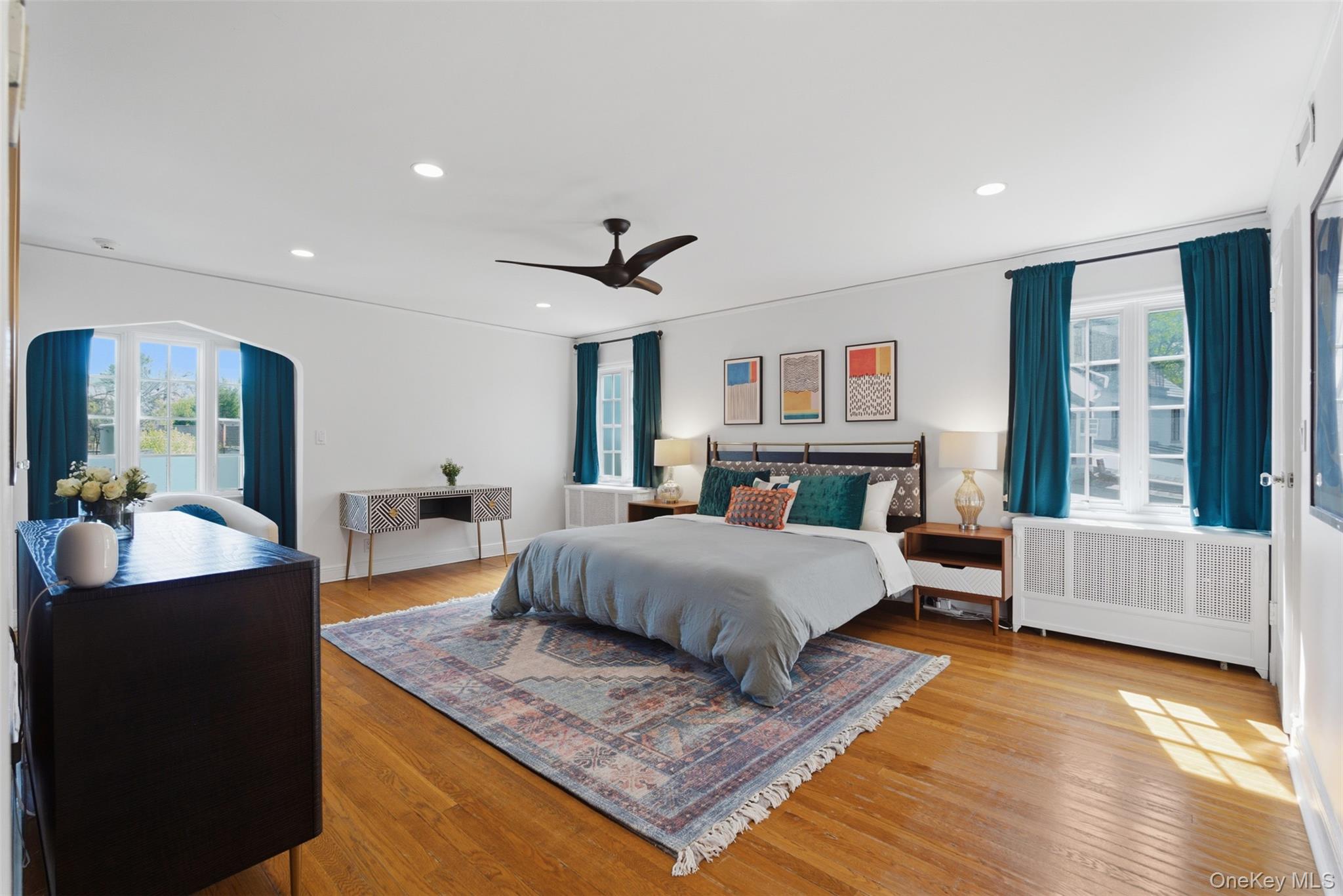 42 Mulberry Lane New Rochelle, NY 10804 - Photo 21 of 43 a spacious bedroom with a large bed and a couch