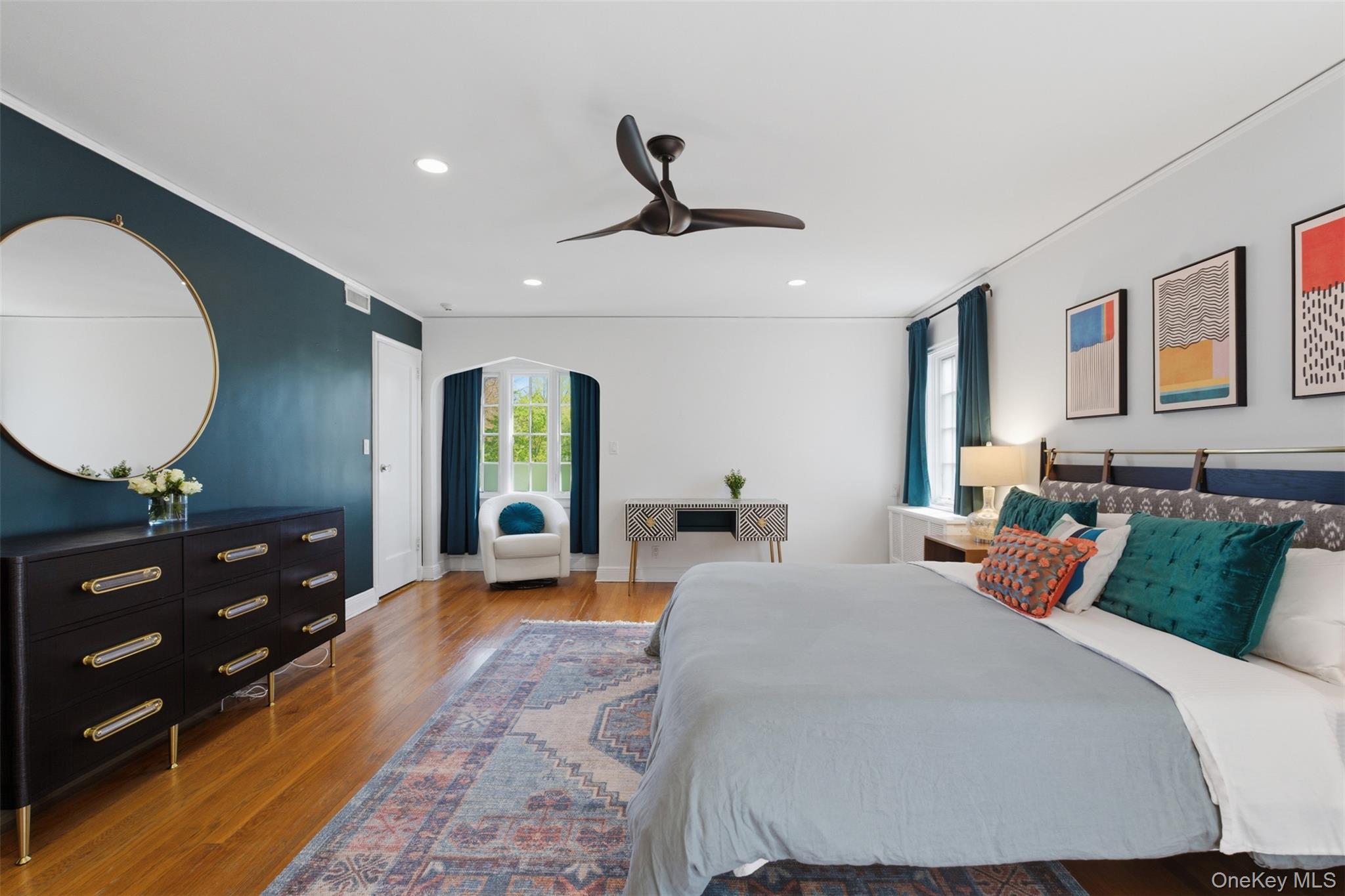 42 Mulberry Lane New Rochelle, NY 10804 - Photo 22 of 43 a bedroom with a bed and wooden floor