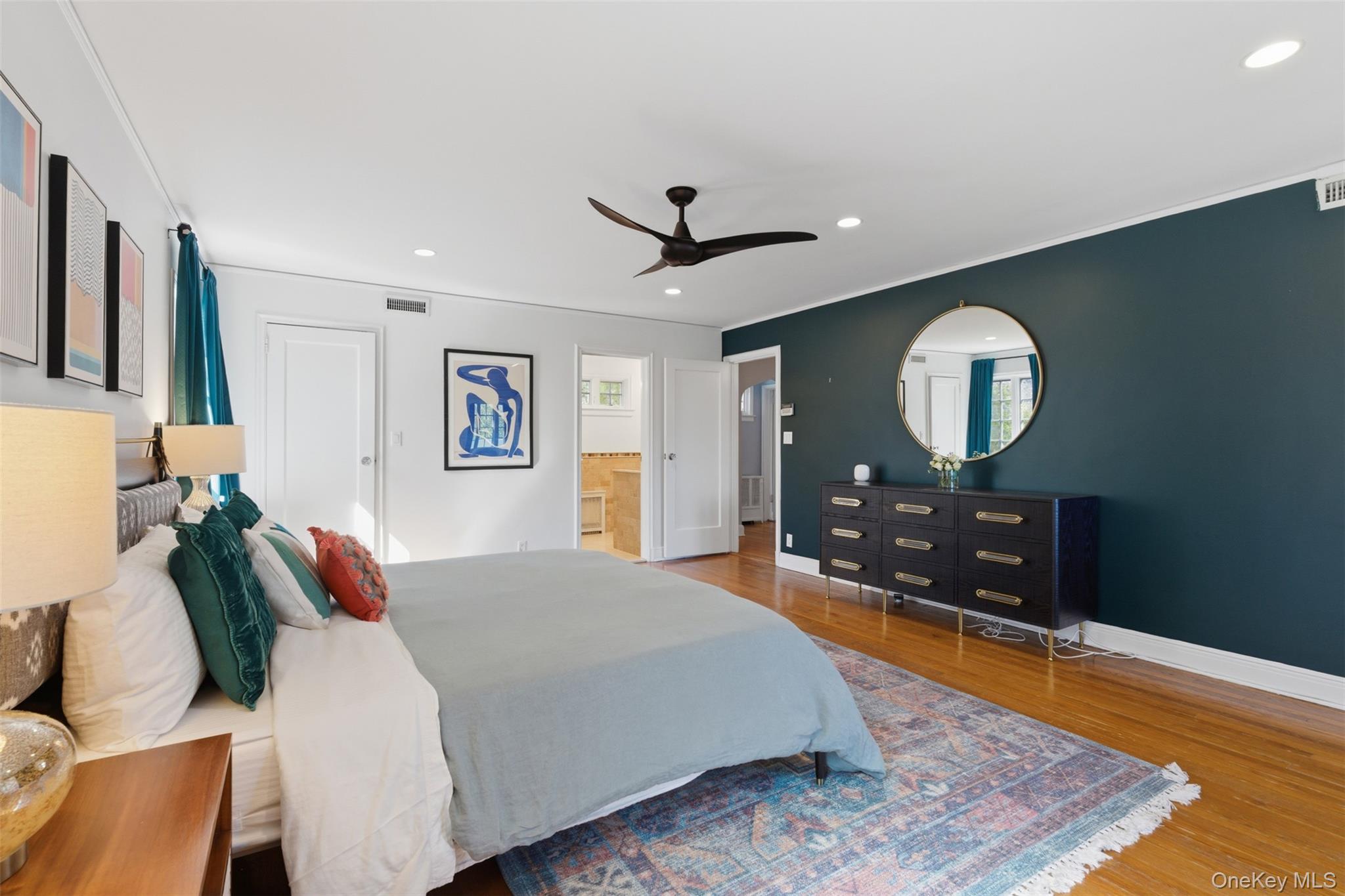 42 Mulberry Lane New Rochelle, NY 10804 - Photo 23 of 43 a bed room with a bed mirror and a night stand