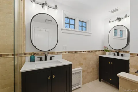 a bathroom with a sink a mirror and a toilet