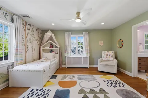 a living room with furniture and a rug