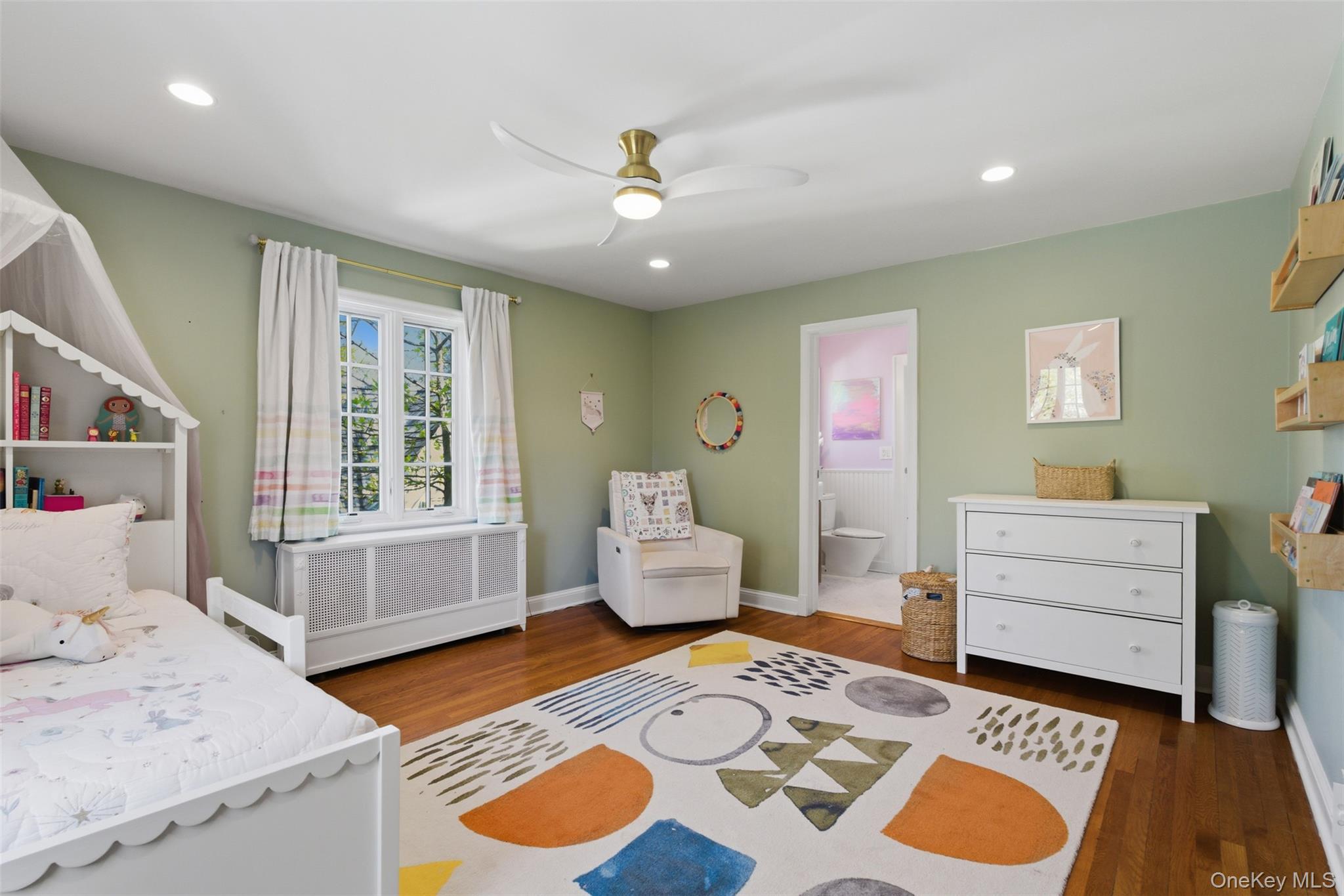 42 Mulberry Lane New Rochelle, NY 10804 - Photo 31 of 43 a bedroom with a bed and wooden floor