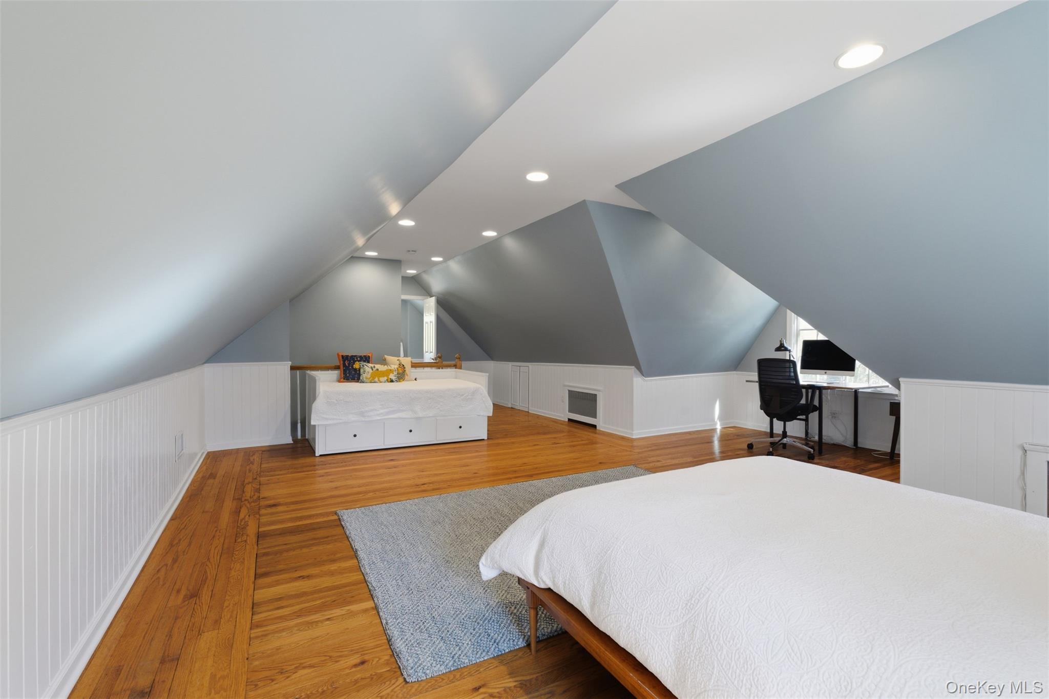 42 Mulberry Lane New Rochelle, NY 10804 - Photo 33 of 43 a bedroom with a bed and a large mirror