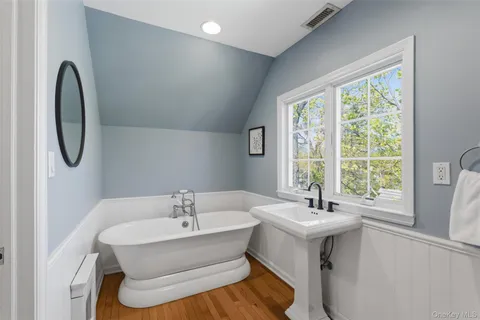 a bathroom with a sink and a window