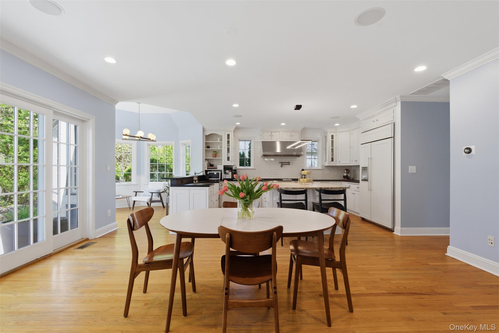 42 Mulberry Lane New Rochelle, NY 10804 - Photo 9 of 43 a dining room with furniture and wooden floor