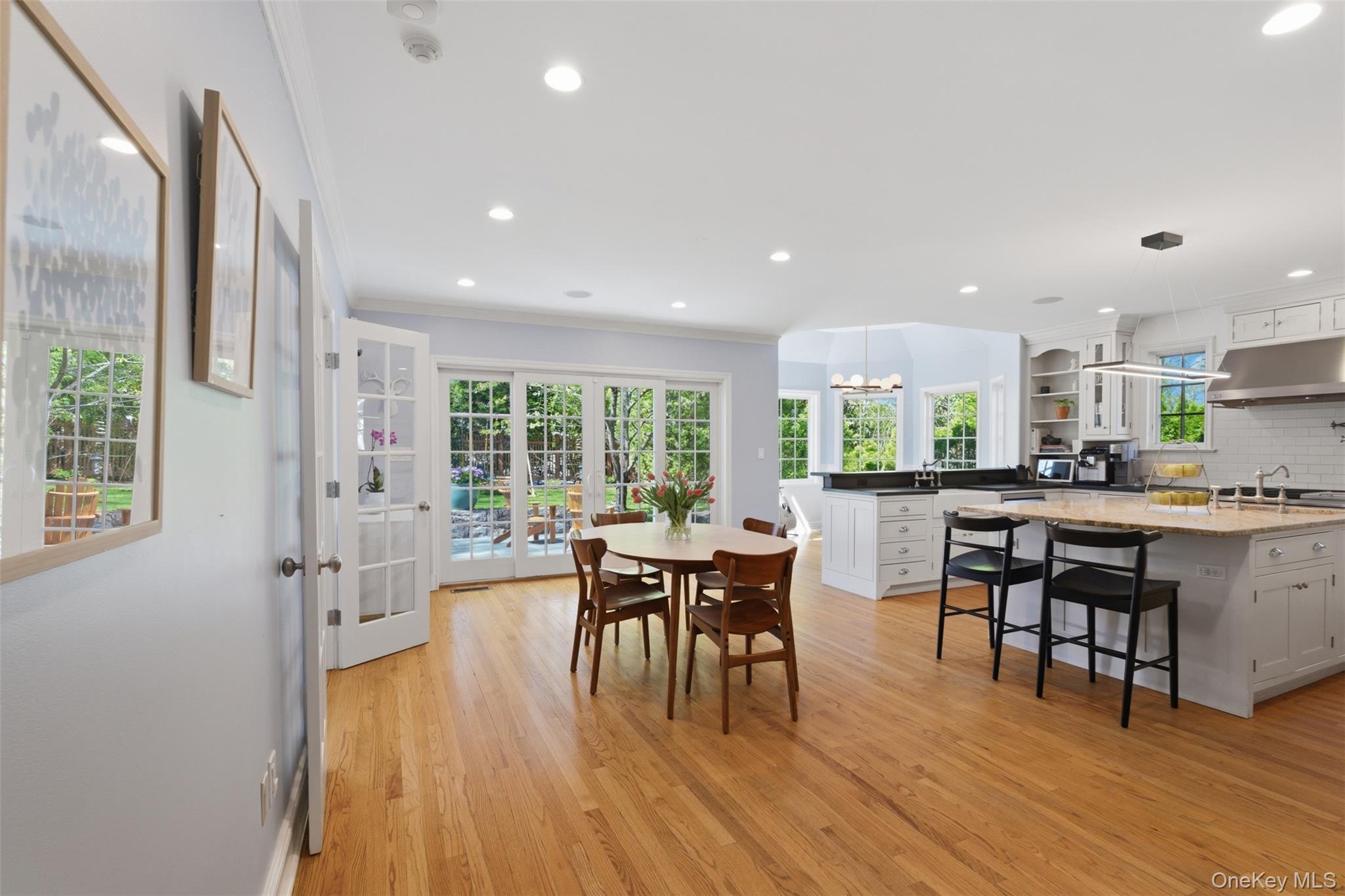 42 Mulberry Lane New Rochelle, NY 10804 - Photo 10 of 43 a kitchen with a table chairs and wooden floor
