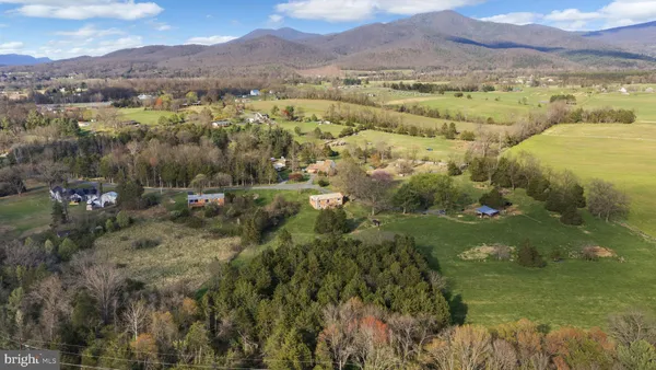 a view of a garden with an outdoor seating