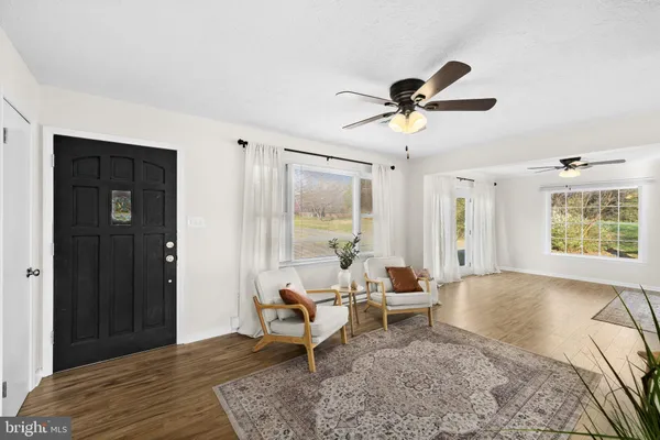 a living room with furniture and window