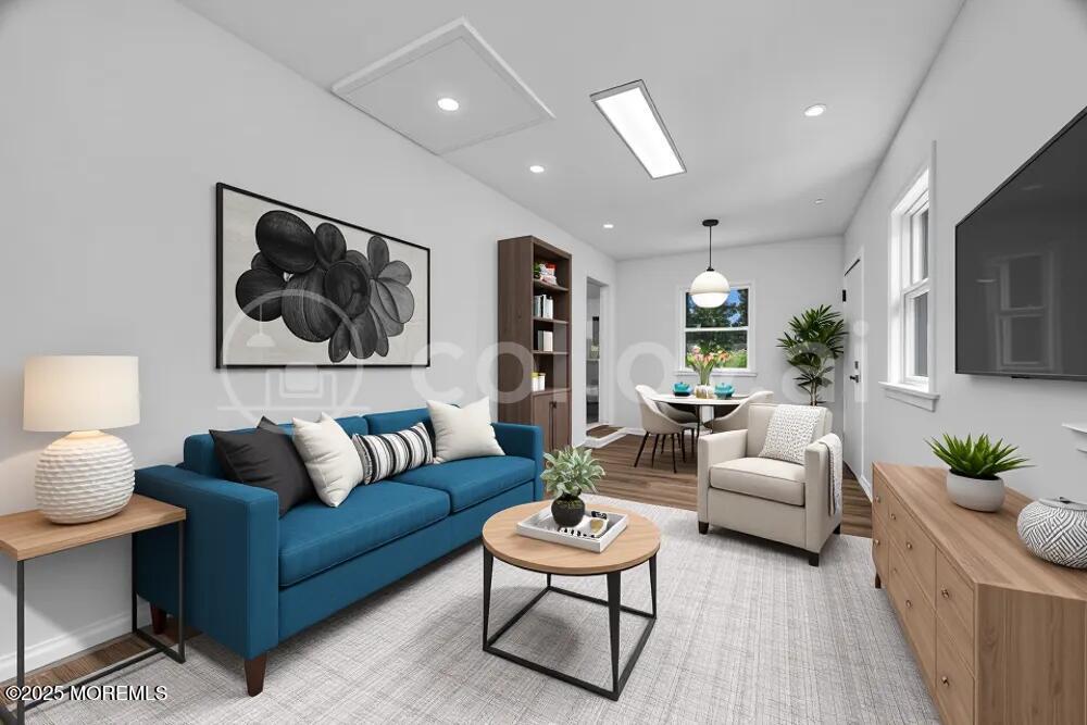 717 Holmdel Road Holmdel, NJ 07733 - Photo 19 of 39 a living room with furniture or couch and a flat screen tv