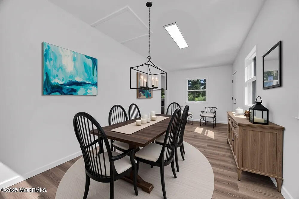 717 Holmdel Road Holmdel, NJ 07733 - Photo 21 of 39 a view of a dining room with furniture and wooden floor
